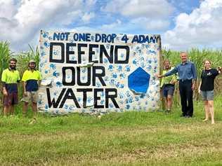 WATER: Bob Brown with cane farmer Wayne Borellini to his left in front of the Defend our Water sign. Picture: Contributed