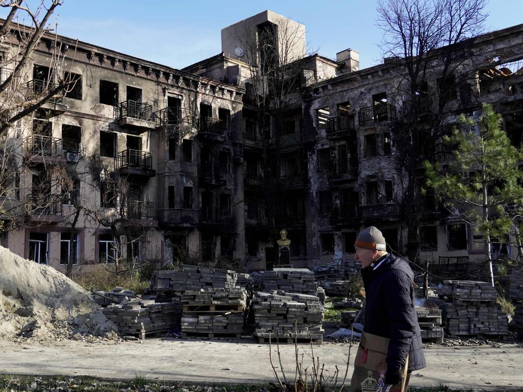 A man walks in front of a damaged building in the Russian-occupied Azov Sea port city of Mariupol. Picture: AFP