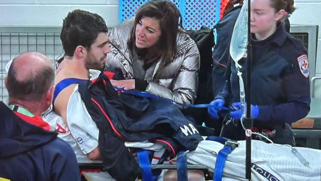 Christian Petracca on his way to hospital after an accidental knee in the ribs