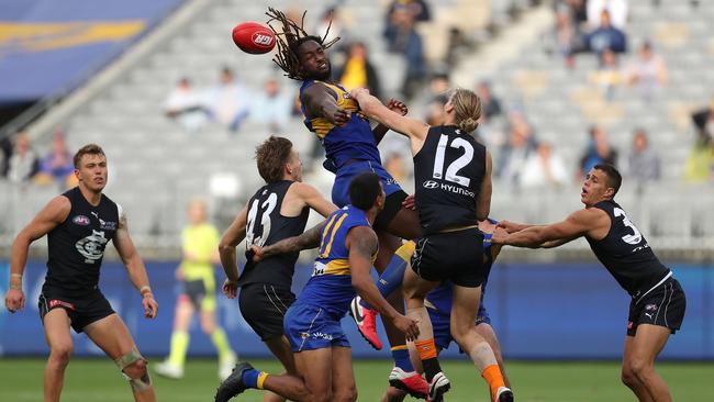 West Coast’s Nic Naitanui and Carlton’s Tom De Koning contest the ruck at Optus Stadium on Sunday. Picture: Getty Images