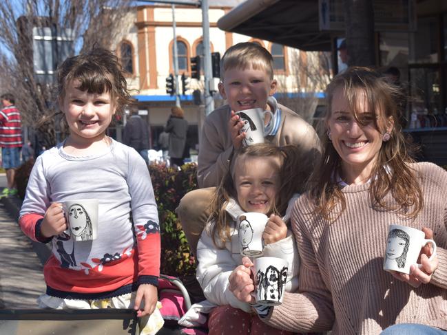 Liza, Levi, Grace, and Stina Gabriel-Gray showing off their Evergreen at Sea designs, which were for sale during the suitcase rummage at Jumpers and Jazz in July. Photo: Jessica Paul / Warwick Daily News