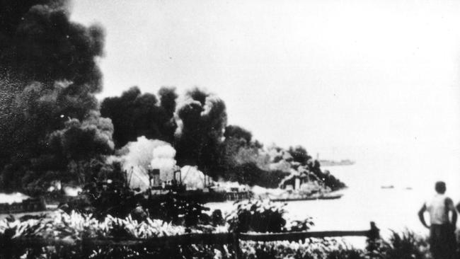 Darwin Harbour and the USS Peary up in smoke after the Japanese army bombed Darwin on February 19, 1942. Picture: News Ltd