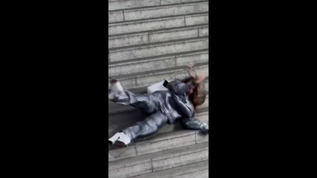 Model takes a tumble in $2,500 outfit