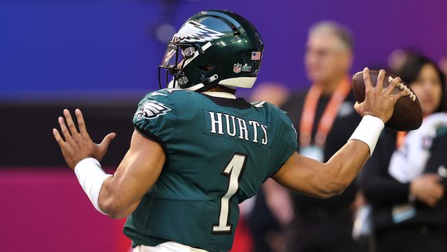 Jalen Hurts of the Philadelphia Eagles warms up before playing against the Kansas City Chiefs in Super Bowl LVII, where nonalcoholic beer commercials are set to dominate.