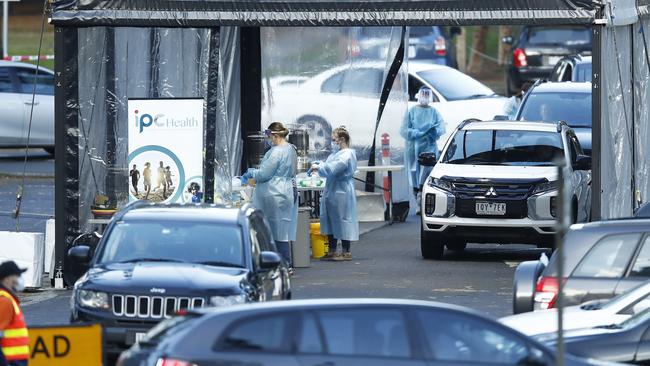 COVID-19 testing staff are seen at a pop-up site at Keilor, where another family outbreak occurred. Picture: Daniel Pockett/Getty Images