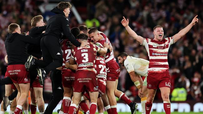 MANCHESTER, ENGLAND - OCTOBER 14: Morgan Smithies Wigan Warriors (R) celebrates with teammates after the team's victory during the Betfred Super League Final match between Wigan Warriors v Catalans Dragons at Old Trafford on October 14, 2023 in Manchester, England. (Photo by Jan Kruger/Getty Images)