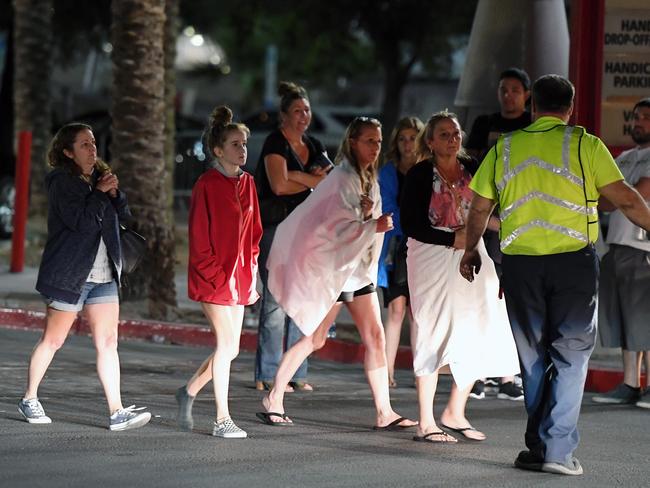 People are directed to rides outside the Thomas &amp; Mack Center after a mass shooting at a country music festival in Las Vegas, Nevada. Picture: Getty