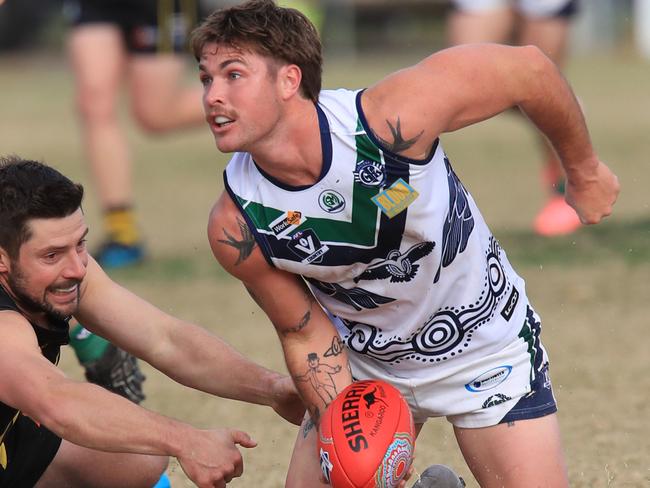 Football St Mary's v Colac GFNL.St Mary's 9 Harry Benson is tackled by  Colac 3 Kody SpokesPicture: Mark Wilson