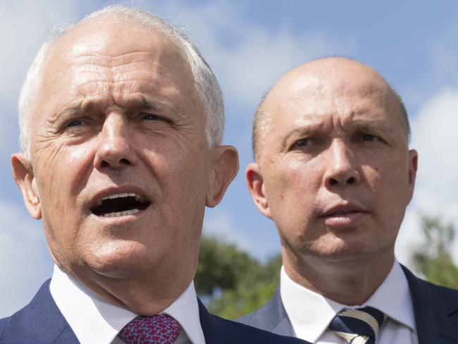 Australian Prime Minister Malcolm Turnbull (left) and Member for Dickson Peter Dutton speak to media in Murrumba Downs, Brisbane, Tuesday, April 3, 2018. Mr Turnbull announced funding for a $150 million upgrade to the Bruce Highway. (AAP Image/Glenn Hunt) NO ARCHIVING, EDITORIAL USE ONLY