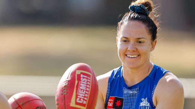 MELBOURNE, AUSTRALIA - NOVEMBER 22: Emma Kearney, Captain of the Kangaroos in seen with Jenna Bruton of the Kangaroos during a North Melbourne Kangaroos training session at Arden Street Oval on November 22, 2024 in Melbourne, Australia. (Photo by Dylan Burns/AFL Photos via Getty Images)