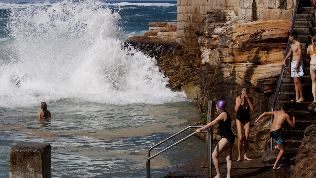 People gather to watch large swell at Coogee Beach on Good Friday. Picture: NewsWire / Nikki Short