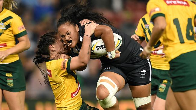 Lilietta Maumau is tackled by Simaima Taufa.