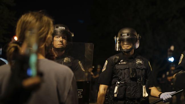 Police form a security line as protesters advance. Picture: Maya Alleruzzo/AP