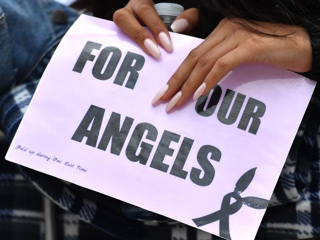 A fan holds a sign as music fans arrive at the Old Trafford Cricket Ground ahead of the One Love Manchester tribute concert in Manchester on June 4, 2017. Picture: Anthony Devlin/AFP