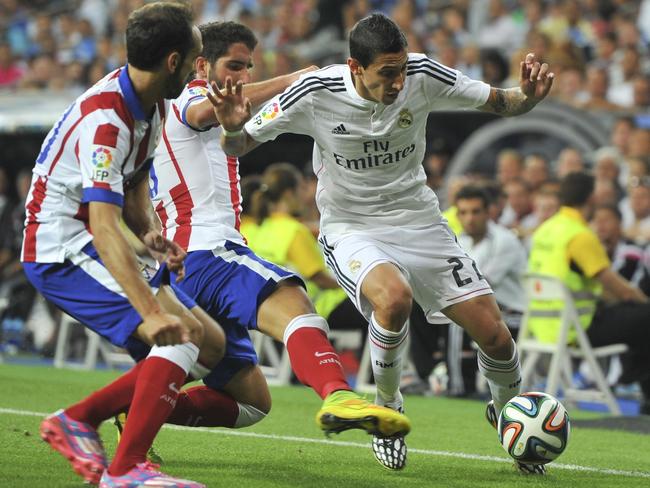 Angel di Maria (R) playing for Real Madrid against Atletico Madrid during the Spanish Super Cup.