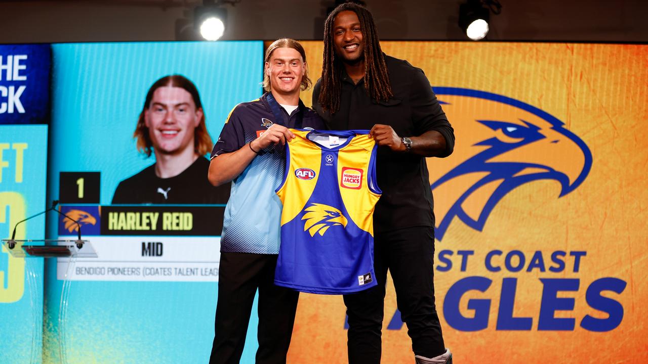 Harley Reid is presented with his jumper by Nic Naitanui of the Eagles after being selected with the number 1 pick by the West Coast Eagles during the 2023 AFL Draft at Marvel Stadium on November 20, 2023 in Melbourne, Australia. (Photo by Michael Willson/AFL Photos via Getty Images)