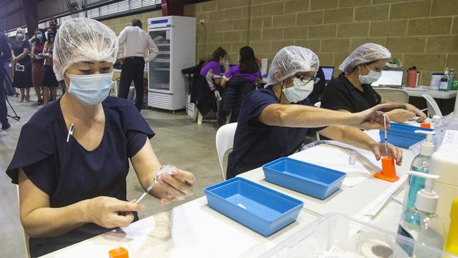 Nurses prepare AstraZeneca doses at the Claremont Showgrounds COVID-19 vaccine centre in Perth on Wednesday. Picture: Getty Images