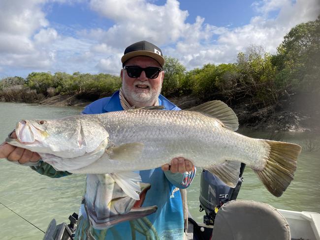 Rockhampton Recreational Fishers’ Michael Powell holding a huge barramundi he caught and then released