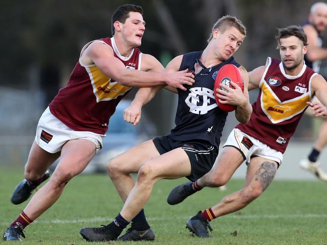 Leigh Judd tries to spin away from a tackle last season for Epping. 