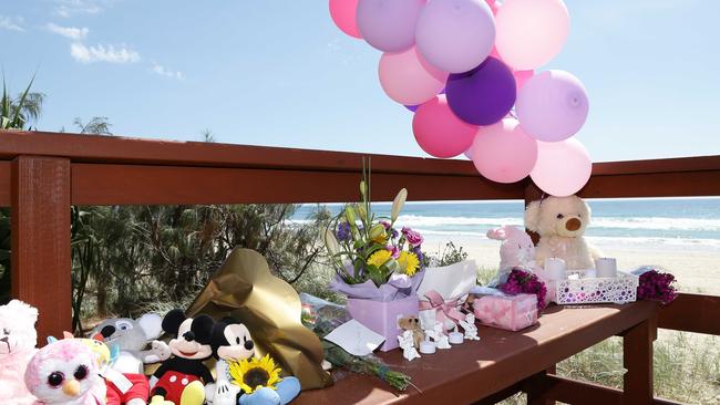 Teddies and balloons at a tribute to the baby that was found dead on the beach in Surfers Paradise. Photo: Tertius Pickard