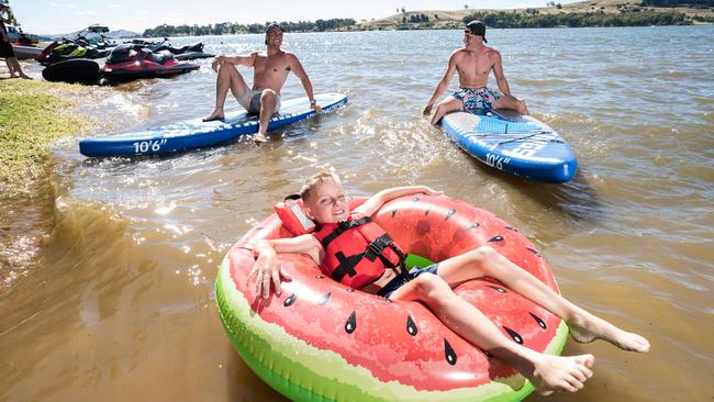 Willem Rainken, Mervin McLaughin and Daun Otto float their cares away at Lake Hume. Picture: NCA NewsWire/Simon Dallinger