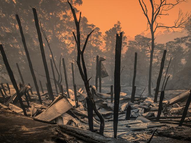 EMBARGO SUNDAY OCT 3 :  Fighting Spirit: a book commemorating the Black Summer bushfires and charting the recovery process:   Photo submitted for inclusion in Fighting Spirit bushfire book, by David Wallace (NSW). The remains of David’s neighbour’s house in Mogo village, NSW, the day after the fires came through. Jan 1, 2020.