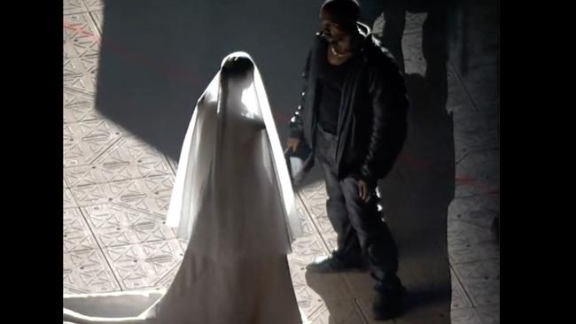 Kim Kardashian in a wedding dress at Kanye West's DONDA event. Picture: Apple Music