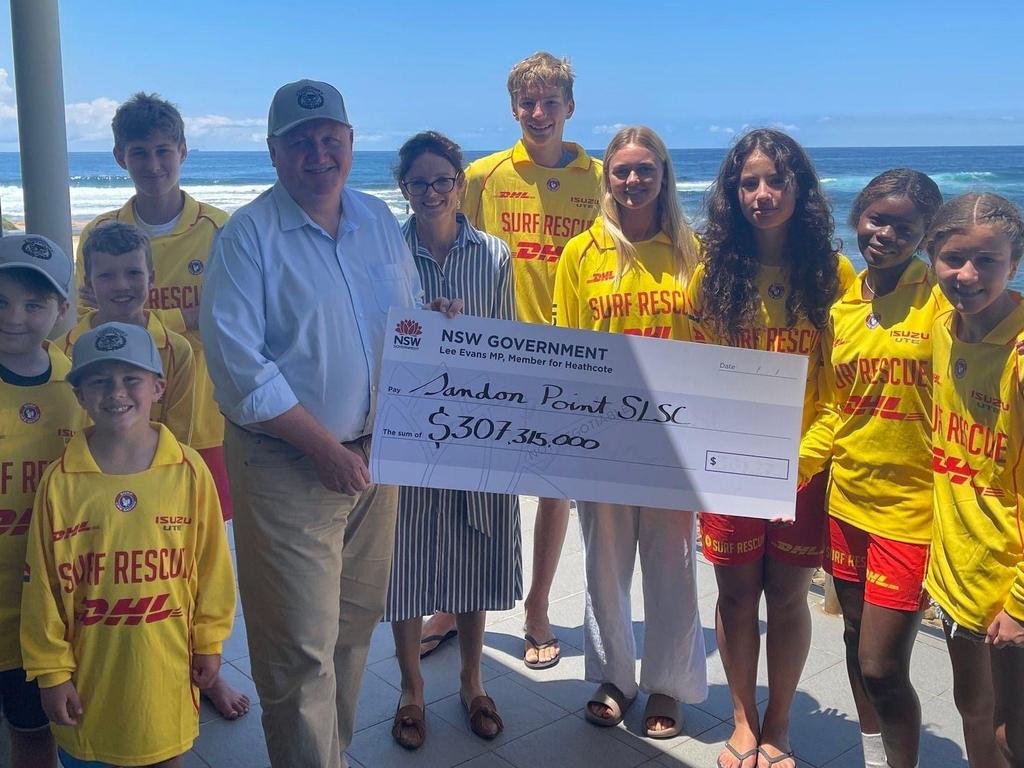 Heathcote MP Lee Evans puts smiles on local surf lifesaver faces after giving them a grant of more than “$300 million”. Pictured: Social Media