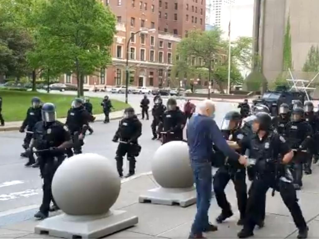 Mr Gugino approaching the group of riot police. Picture: Mike Desmond/WBFO NPR/AFP