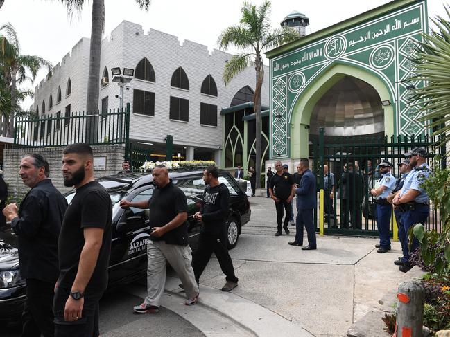 The black hearse carries the coffin after his funeral service at the Fatima Al-Zahra Masjid mosque in Sydney. Picture: AAP