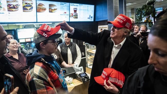 Former president Donald Trump hands out MAGA hats and greets patrons during an off-the-record stop at a McDonald's restaurant in East Palestine, Ohio. Picture: Jabin Botsford/The Washington Post