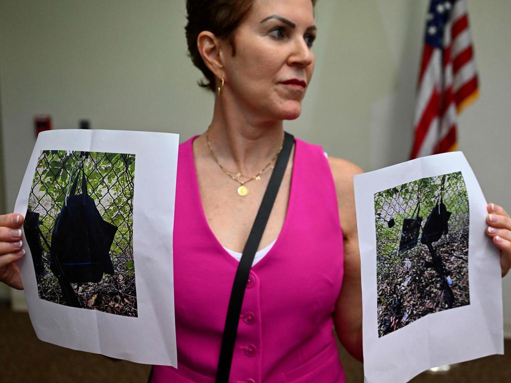 Press Information Officer Teri Barbera shows pictures of evidence found at the fence of the golf course where Trump was playing. Picture: Chandan Kanna/AFP