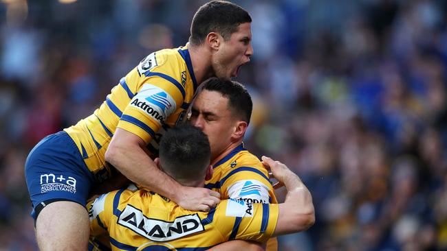 Brad Takairangi is congratulated by Eels teammates after scoring a try. Picture: Getty Images