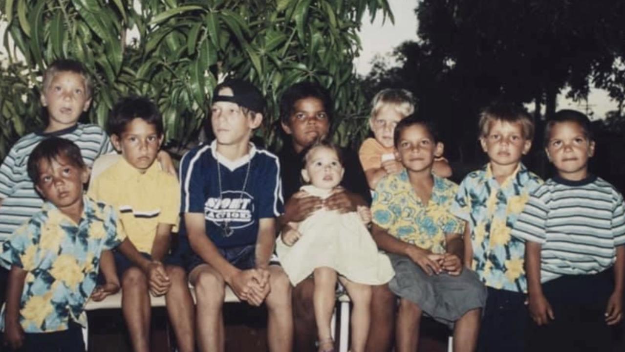 Crow Shane McAdam (third from left), Gold Coast's Jy Farrar (fourth from right), Collingwood's Ash Johnson (second from right) and West Coast's Sam Petrevski-Seton (far right) in their hometown of Halls Creek, WA as children.