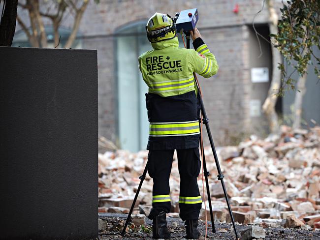 Fire and Rescue NSW crews work at the scene. Picture: Adam Yip