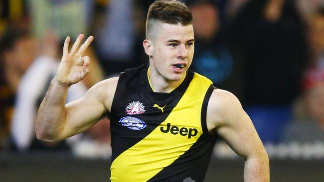 Jack Higgins celebrates a goal against Melbourne.