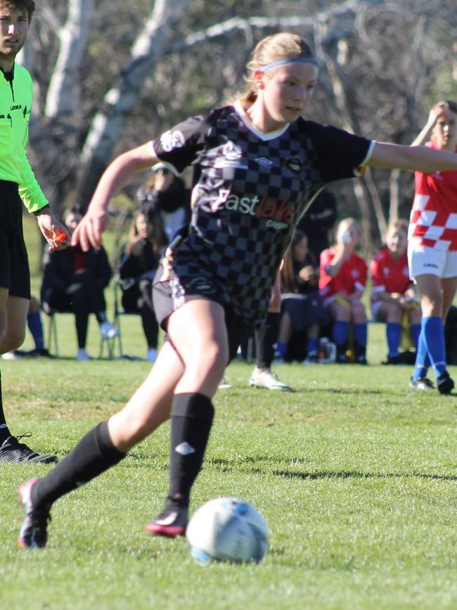 16-year-old Breea Waters kicking goals.