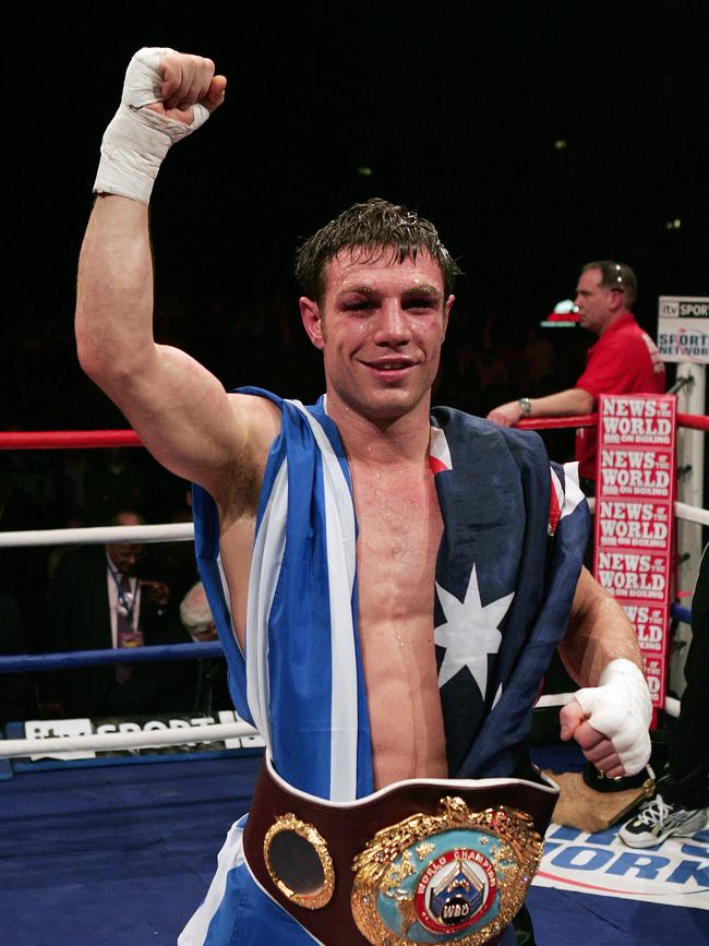 Australian Michael Katsidis celebrates after defeating British Graham Earl in their Interim WBO Lightweight Championship of the World boxing bout at the Wembley Arena, London, 17 February 2007. AFP PHOTO/CARL DE SOUZA