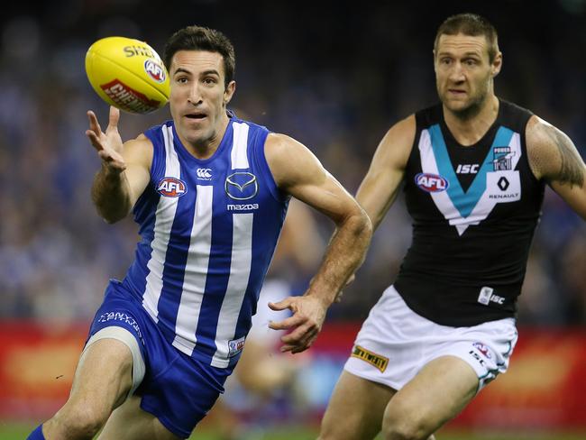 Michael Firrito leads Port Adelaide’s Jay Schulz to the ball. Pic: Michael Klein