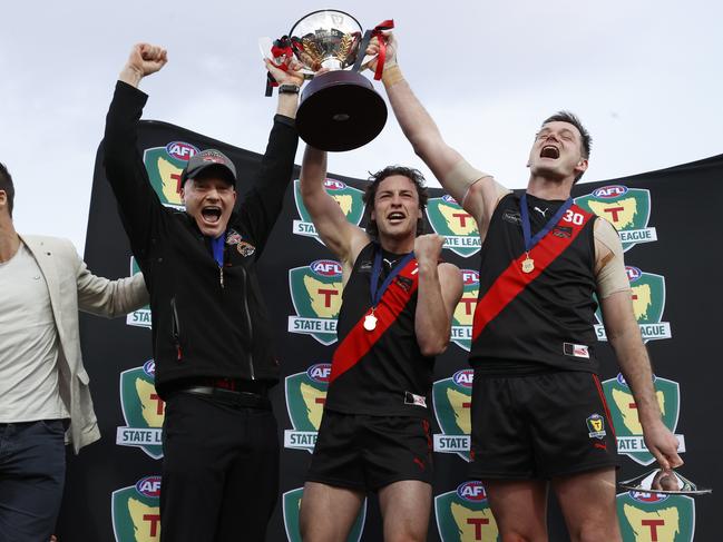 North Launceston coach Adrian Smith celebrates this year’s TSL grand final win with co-captains Fletcher Bennett and Alex Lee. Picture: Nikki Davis-Jones