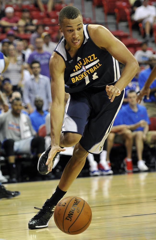 Utah Jazz draftee Dante Exum drives to the hoop against the Philadelphia 76ers during an NBA summer league basketball game - his best of the pre-season fixtures.