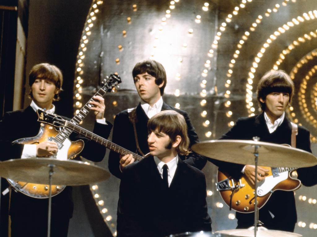 British rock band The Beatles in a promotional picture from 1966, the year of the band's seventh album release, titled 'Revolver'. L-R: John Lennon, Paul McCartney, Ringo Starr (seated at drums) and George Harrison. Picture: supplied / Universal Music Australia