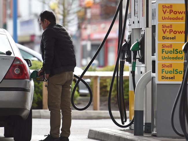 A man fills up his car from a petrol pump. Picture: AFP PHOTO / PAUL ELLIS