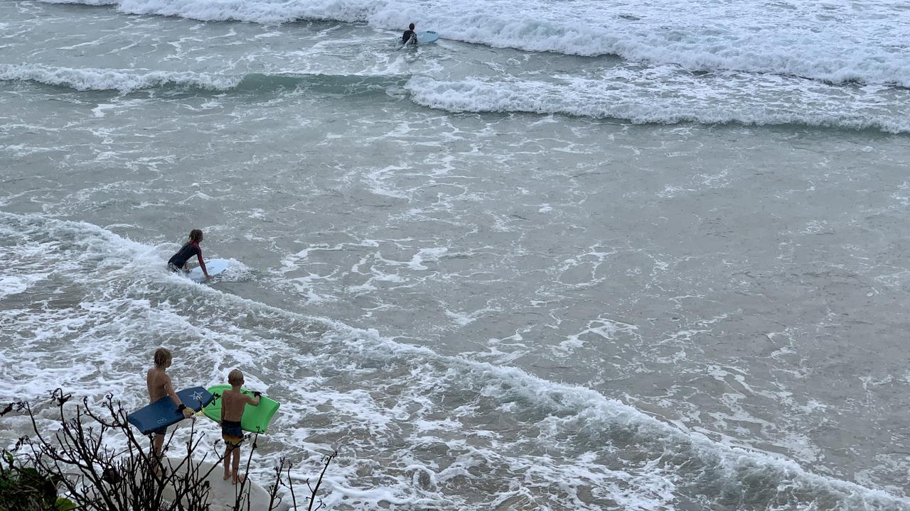 The weather wasn't as rainy as previus days, so many beach fanatics decided to check out the swell from the dunes or to get in the water at Clarkes Beach on Tuesday.