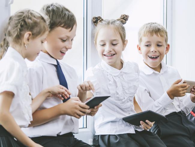 QST generic group of happy young school children in uniform