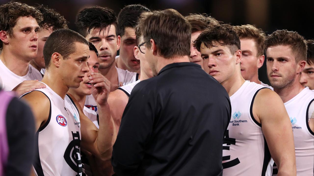 Carlton players listen to senior coach David Teague. Picture: Sarah Reed