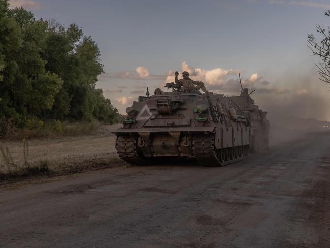 Ukrainian servicemen operate an armoured military vehicle in the Sumy region, near the border with Russia, on August 12, 2024, amid the Russian invasion of Ukraine. Ukraine launched a surprise offensive into the Russian border region of Kursk on August 6, 2024, capturing over two dozen towns and villages in the most significant cross-border attack on Russian soil since World War II. Ukraine's military chief Oleksandr Syrsky told President Volodymyr Zelensky in a video posted on August 12, 2024 that his troops now control about 1,000 square kilometres of Russian territory and are continuing 