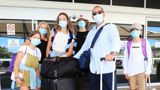 Tim Maguire with wife Nikki and children Ella, Nikki, Olivia, Will and Sam from Sydney arrives on the last flights out of Sydney before a hard lock down commences. Photo: Scott Powick Newscorp