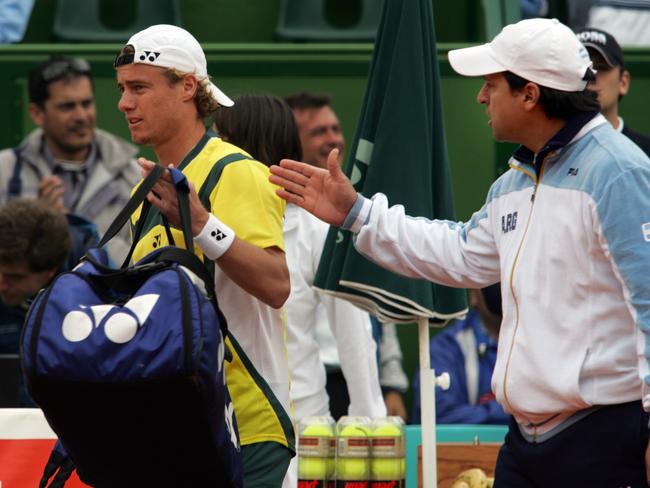 Australian Lleyton Hewitt walks away as Argentine team captain Alberto Mancini approaches to greet him after the former lost to Argentine Jose Acasuso at Parque Roca stadium in Buenos Aires in 2006. Picture: Daniel Garcia/AFP