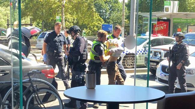 Police arrested a man in East Melbourne.